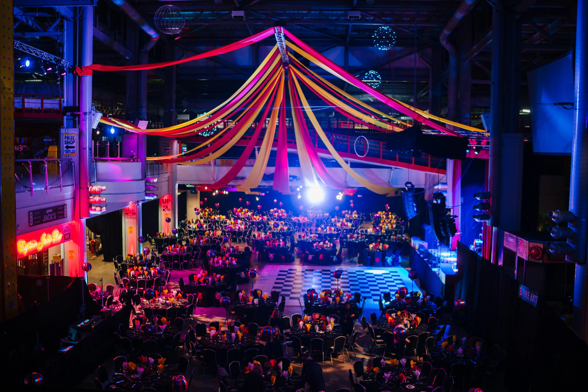 The Grand Piers main event hall with large circular tables and decorations with a event in full swing